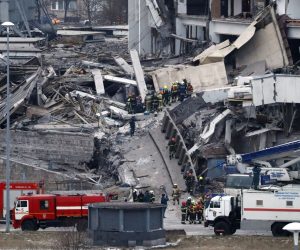 epa08182138 Russian rescues at the site of partially collapsed 'Peterburgsky' Sports and Concert Complex in St.Petersburg, Russia, 31 January 2020. The roof of the building collapsed during dismantling, people might be trapped under the debris, according to reports.  EPA/ANATOLY MALTSEV