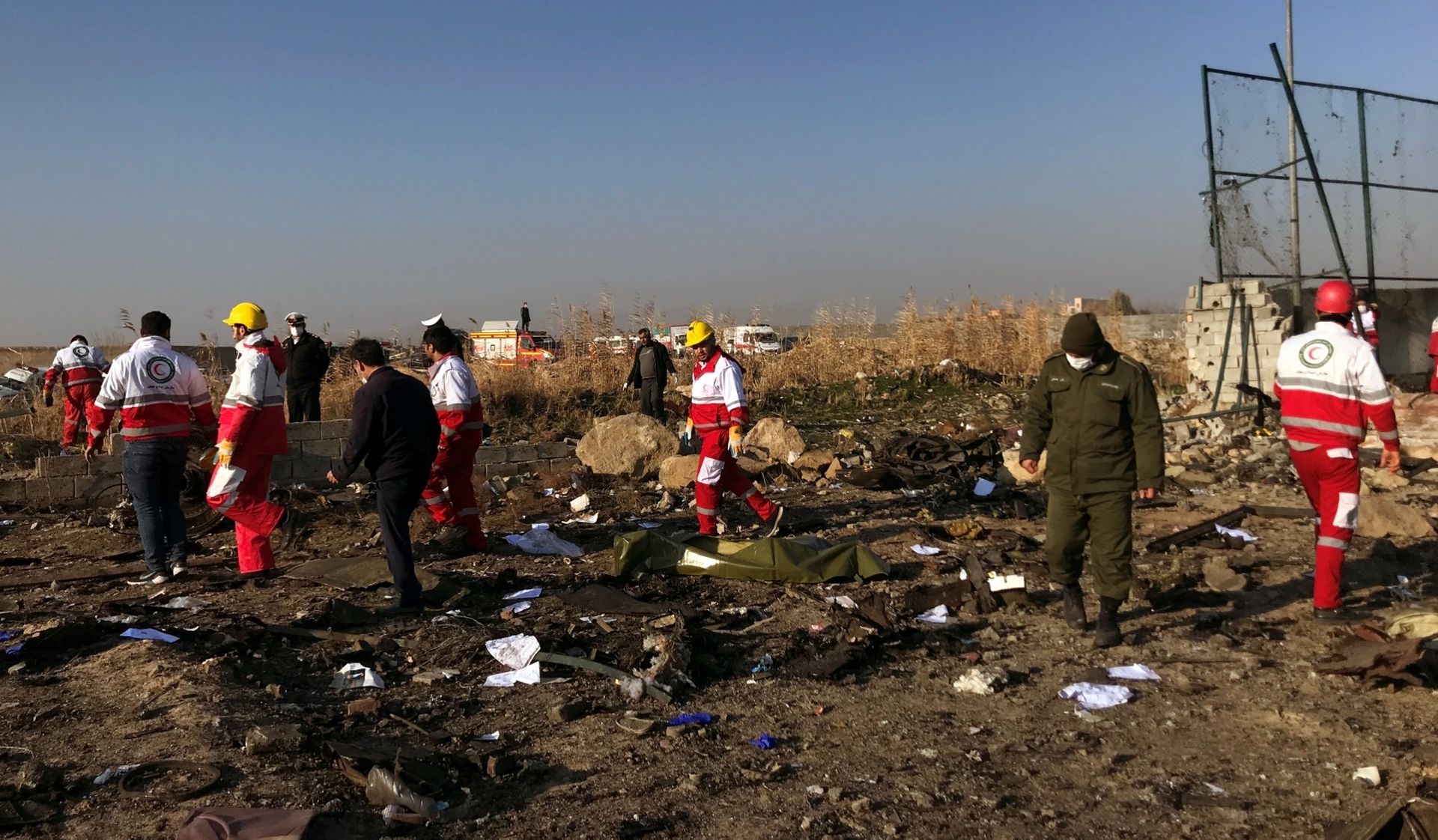 Rescuers team check the debris from a plane crash belonging to Ukraine International Airlines after take-off from Iran's Imam Khomeini airport, on the outskirts of Tehran Rescuers team check the debris from a plan crash belonging to Ukraine International Airlines after take-off from Iran's Imam Khomeini airport, on the outskirts of Tehran, Iran January 8, 2020. Nazanin Tabatabaee/WANA (West Asia News Agency) via REUTERS ATTENTION EDITORS - THIS IMAGE HAS BEEN SUPPLIED BY A THIRD PARTY WANA NEWS AGENCY