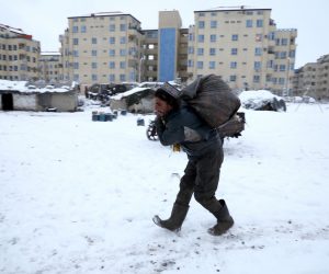 An Afghan man carries a sack on his back during a snowfall in Kabul An Afghan man carries a sack on his back during a snowfall in Kabul, Afghanistan January 12, 2020.  REUTERS/Omar Sobhani OMAR SOBHANI