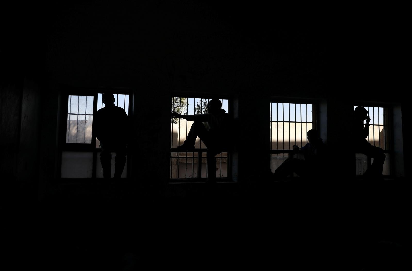 People suffering from mental illnesses sit at the windows of a psychiatric care centre in Sanaa People suffering from mental illnesses sit at the windows of a psychiatric care centre in Sanaa, Yemen December 31, 2019. REUTERS/Khaled Abdullah KHALED ABDULLAH