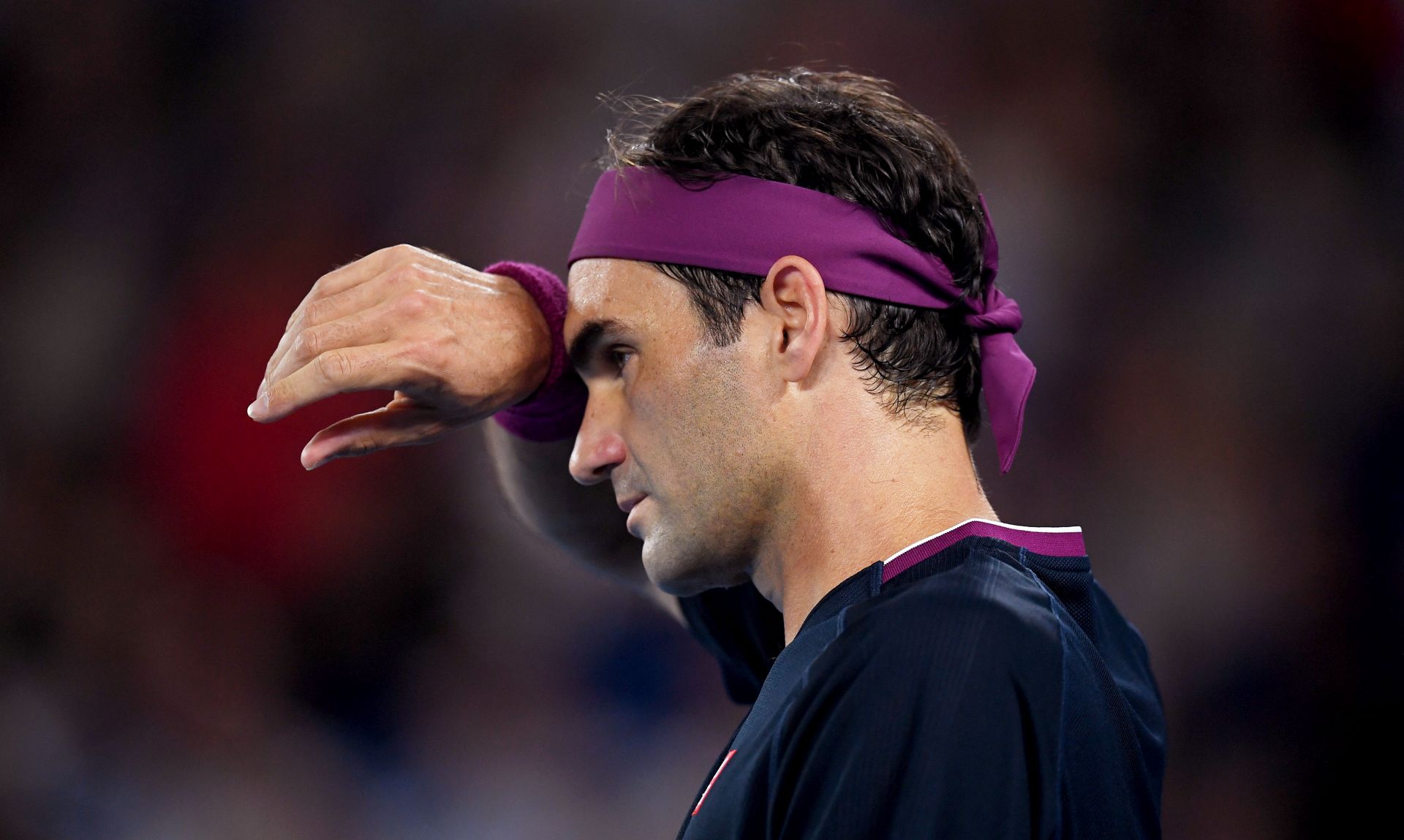 epa08178260 Roger Federer of Switzerland reacts during his semi final match against Novak Djokovic of Serbia at the Australian Open Grand Slam tennis tournament at Rod Laver Arena in Melbourne, Australia, 30 January 2020.  EPA/LUKAS COCH AUSTRALIA AND NEW ZEALAND OUT