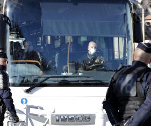 epa08182112 A French military officer drives a bus transporting French citizens repatriated from Wuhan wearing masks to a holiday resort where they will be quarantined for 14 days, in Carry-le-Rouet, southern France, 31 January 2020. Six cases of the Wuhan coronavirus have been identified in France, the Health Ministry announced on 30 January. The coronavirus, called 2019-nCoV, originating from Wuhan, China, has spread to all the 31 provinces of China as well as more than a dozen countries in the world. The outbreak of coronavirus has so far claimed 213 lives and infected more than 8,000 others, according to media reports.  EPA/SEBASTIEN NOGIER