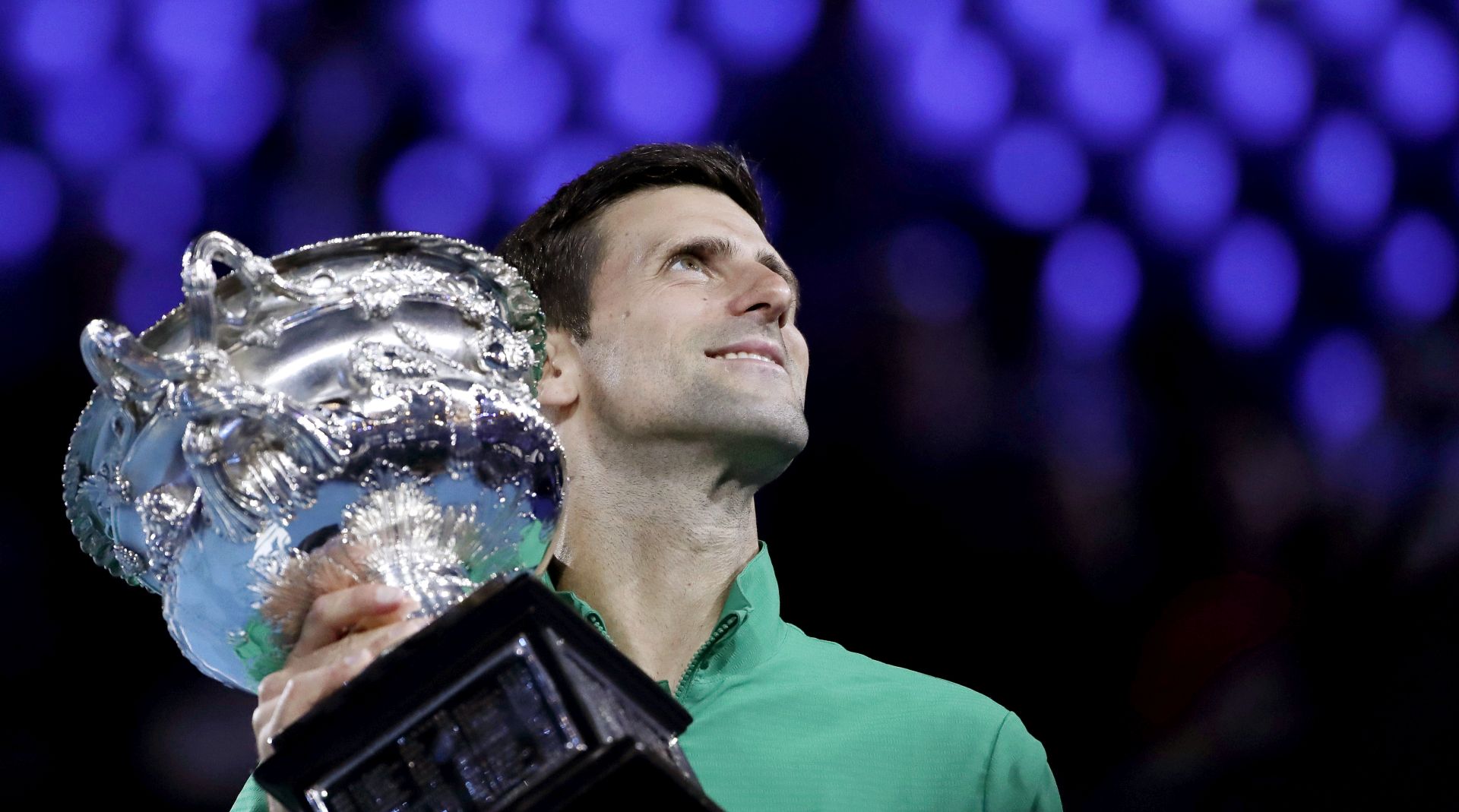 epa08187781 Novak Djokovic of Serbia poses for photos with the Norman Brookes Challenge Cup after winning his men's singles final match against Dominic Thiem of Austria at the Australian Open Grand Slam tennis tournament in Melbourne, Australia, 02 February 2020. EPA/FRANCIS MALASIG