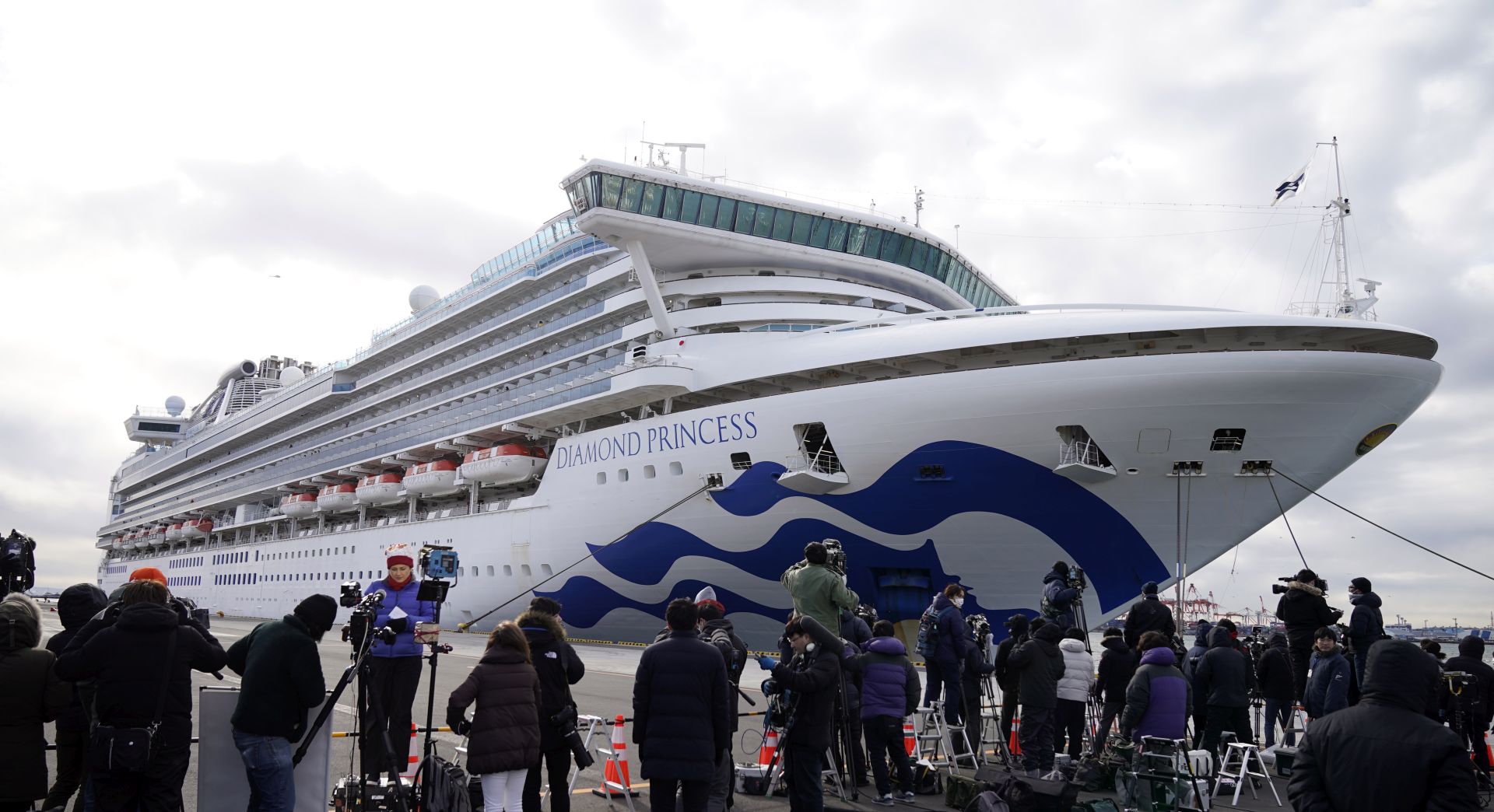epa08196603 Media gather before the Diamond Princess cruise ship that docked at the port of Yokohama in Yokohama, Japan, 06 February 2020. The cruise ship with around 3,700 passengers on board docked in the morning to restock supplies. According to latest media reports, 10 more people have tested positive for the new coronavirus. A total number of 20 people from the ship have been infected by the coronavirus, raising the number of infections to 45 in Japan. According to media reports, around 28,000 people are infected and at least 563 have died from coronavirus.  EPA/FRANCK ROBICHON