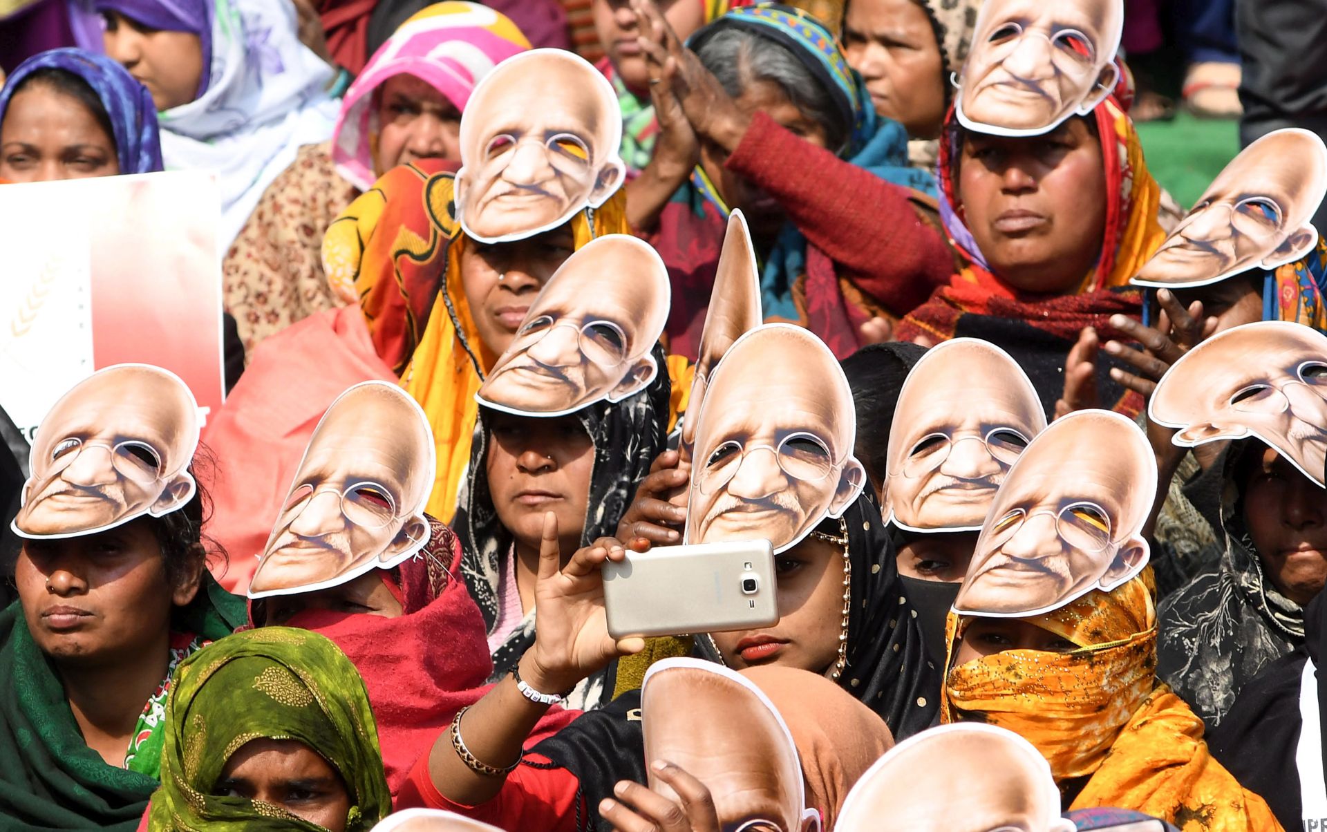 epa08208796 Indian protesters shout slogans wearing masks as they protest against the Citizenship Amendment Act (CAA) and National Register of Citizens (NRC) in New Delhi, India, 10 February 2020.  EPA/STR