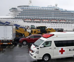 epa08220961 An ambulance believed to be carring an infected passenger of the Diamond Princess cruise ship leaves the Daikoku Pier Cruise Terminal in Yokohama, south of Tokyo, Japan, 16 February 2020. According to latest media reports, another 70 passengers of the Diamond Princess cruise ship have been tested positive for the Covid-19 coronavirus. A total number of 355 people from the ship have been infected by the new coronavirus.  EPA/FRANCK ROBICHON
