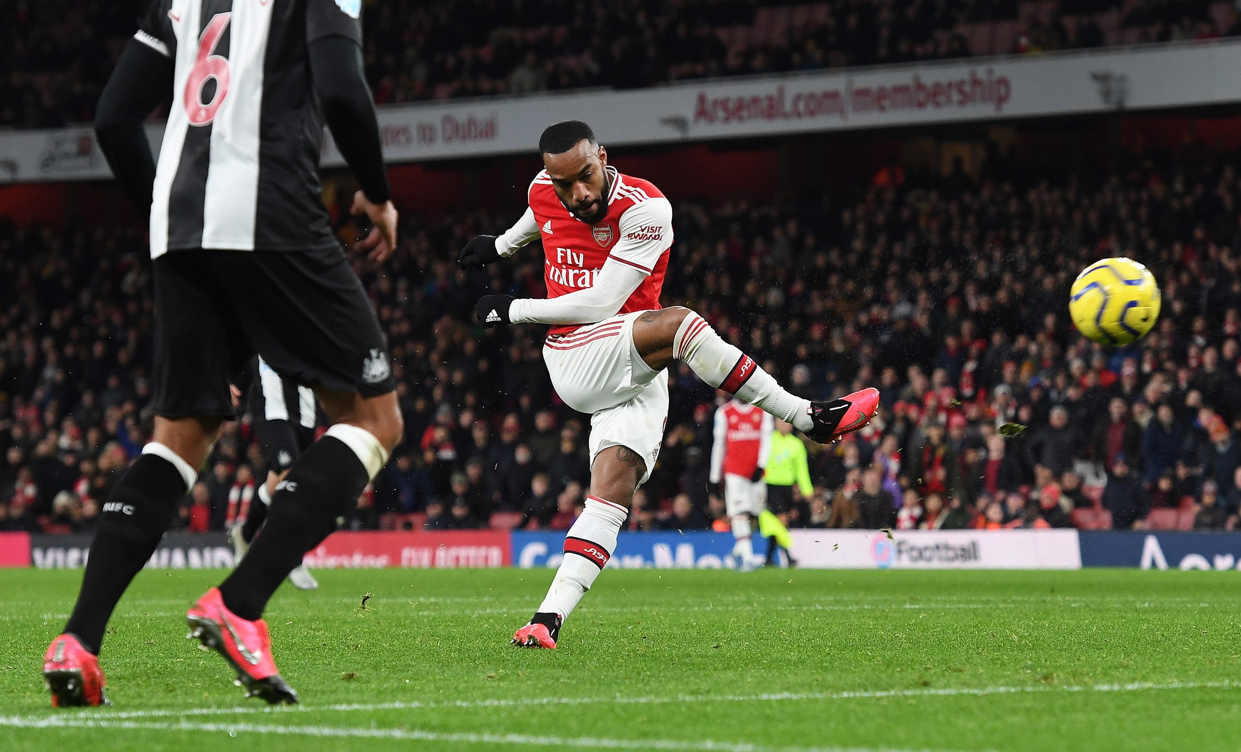 epa08222624 Arsenal's Alexandre Lacazette scores Arsenal's fourth goal of the match against  Newcastle United during an English Premier League soccer match at the Emirates Stadium in London, Britain, 16 February 2020.  EPA/ANDY RAIN EDITORIAL USE ONLY. No use with unauthorized audio, video, data, fixture lists, club/league logos or 'live' services. Online in-match use limited to 120 images, no video emulation. No use in betting, games or single club/league/player publications