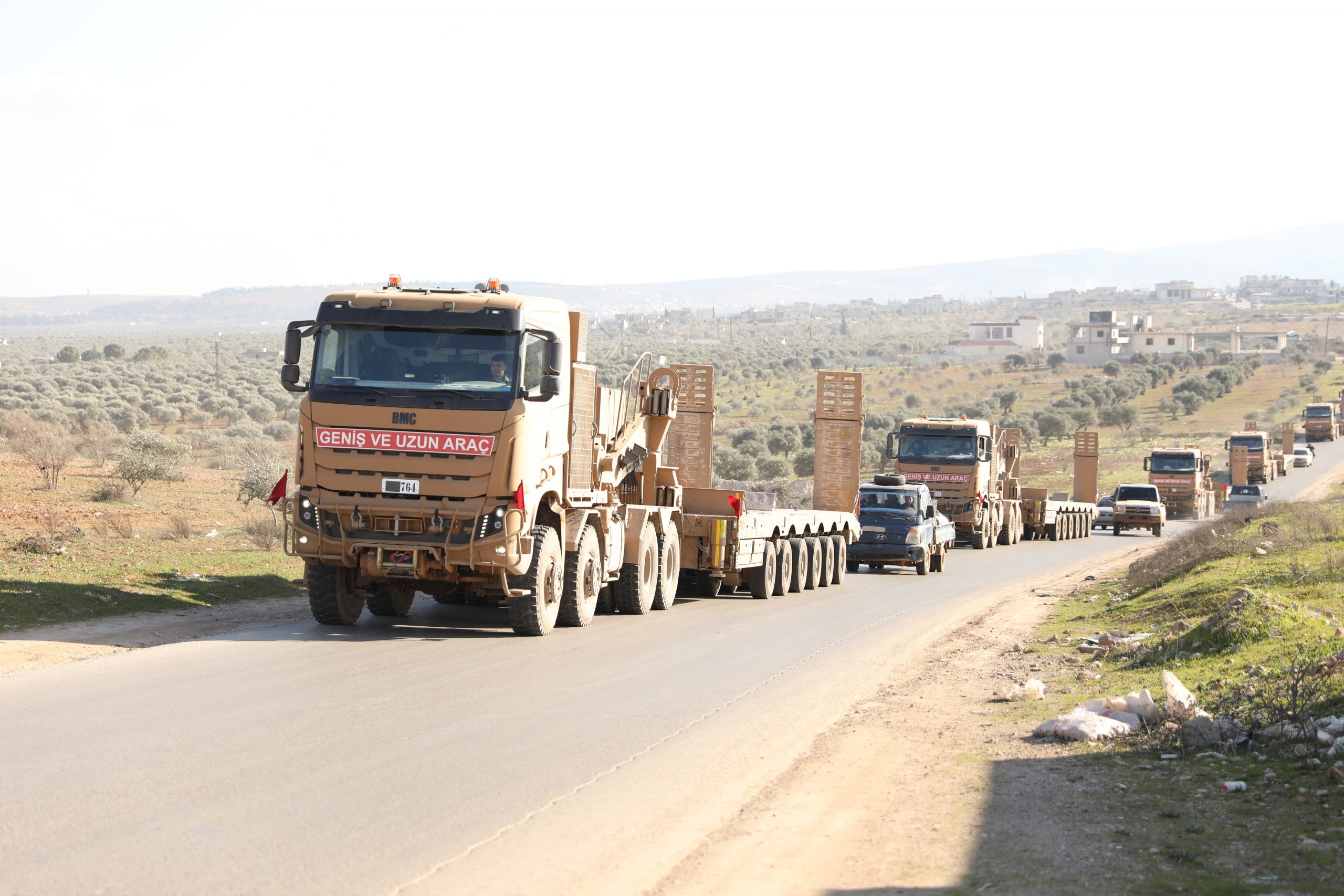 epa08230686 Turkish military vehicles drive east of Idlib, Syria, 20 February 2020.  EPA/YAHYA NEMAH