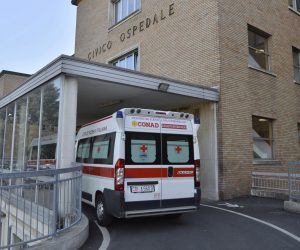 epa08233870 A general view shows an ambulance outside the Codogno Civic Hospital in Lodi, northern Italy, 21 February 2020. Three people in Italy have been reported infected with the novel coronavirus. The first is a man, 38, who is believed to have got the virus after dining with a friend who had come back from China. The man has been admitted to the intensive care ward of a hospital at Codogno near Lodi, in northern Italy. The other two infected are the 38-year-old's wife, a pregnant teacher, who has also been admitted to hospital, and a third person who went to hospital suffering symptoms of pneumonia after having had contact with the 38-year-old.  EPA/ANDREA FASANI