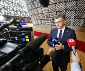 epa08234041 Croatia's Prime Minister Andrej Plenkovic  speaks to media as he arrives at the second day of a Special European Council summit in Brussels, Belgium, 21 February 2020. EU heads of state or government gather for a special meeting to discuss the EU’s long-term budget for 2021-2027.  EPA/JULIEN WARNAND
