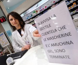 epa08245781 An employee shows a sign informing customers that the disinfectant and protective face masks are sold out at a pharmacy in Palermo, Italy, 25 February 2020. Italian authorities say that there more than 200 confirmed cases of COVID-19 disease were registered in the country, with at least seven deaths. Precautionary measures and ordinances to tackle the spreading of the deadly virus included the closure of schools, gyms, museums and cinemas in the affected areas in northern Italy.  EPA/Igor Petyx