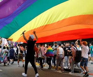 Participants march under a giant rainbow flag during the LGBT Pride parade in Taipei, Taiwan Participants march under a giant rainbow flag during the LGBT Pride parade in Taipei, Taiwan October 26, 2019. REUTERS/Eason Lam EASON LAM