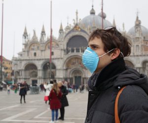 epa08244139 Tourists wearing protective facemasks visit Piazza San Marco, in Venice, Italy, 24 February 2020, during the usual period of the Carnival festivities. Carnival in Venice was cancelled in past two days to minimize the risk of an outbreak of the novel coronavirus (COVID-19) disease in northern Italy. Italian authorities announced on the day that there are over 200 confirmed cases of COVID-19 disease in the country, with at least five deaths. Precautionary measures and ordinances to tackle the spreading of the deadly virus included the closure of schools, gyms, museums and cinemas in the affected areas in the north of the country.