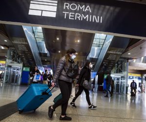 epa08244646 People wearing a protective mask walks at the Termini Station in Rome, Italy, 24 February 2020. Italian authorities announced on the day that there are over 200 confirmed cases of COVID-19 disease in the country, with at least six deaths. Precautionary measures and ordinances to tackle the spreading of the deadly virus included the closure of schools, gyms, museums and cinemas in the affected areas in northern Italy.  EPA/ANGELO CARCONI