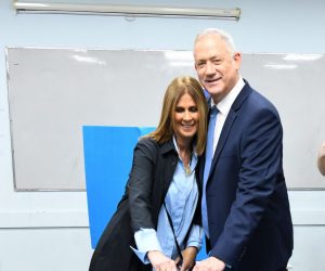 epa08263934 Benny Gantz (C), former Israeli army chief of staff and candidate for prime minister for the Blue and White Israeli centrist political party, and his wife Revital Gantz (L) cast their ballots during the Israeli legislative elections, at a polling station in Rosh Haain, Israel, 02 March 2020. Israelis are heading to the polls for a third general election in less than a year, following the prior elections in April and September to elect the 120 members of the Knesset.  EPA/JINIPIX
