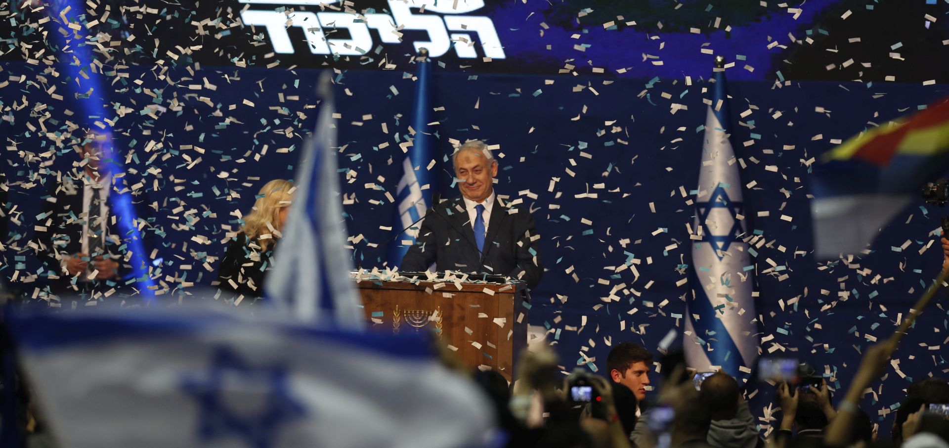 epa08265691 Israeli Prime Minister and Chairman of the Likud Party Benjamin Netanyahu (C) attends a Likud party final election event after early exit polls, in Tel Aviv, Israel, 03 March 2020. It is the third Israeli parliament election in one year.  EPA/ATEF SAFADI
