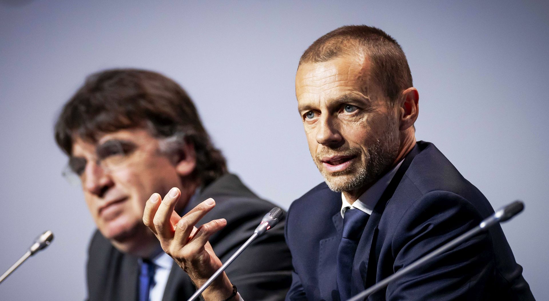 epa08266420 UEFA general secretary Theodore Theodoridis (L) and UEFA president Aleksander Ceferin (R) attend a press conference following the annual UEFA Congress meeting at the Beurs van Berlage building in Amsterdam, Netherlands, 03 March 2020.  EPA/ROBIN VAN LONKHUIJSEN