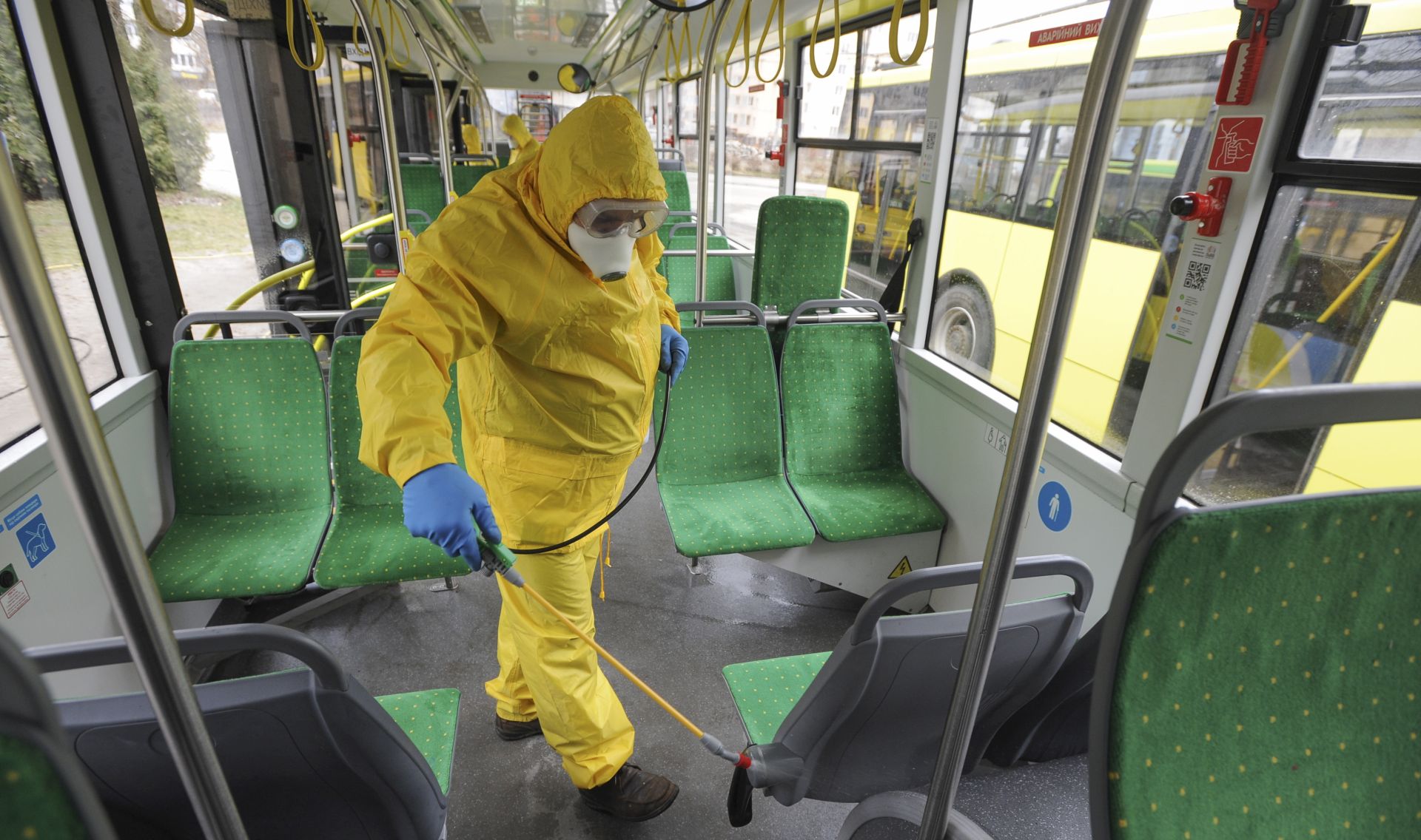 epa08266730 Workers disinfect a trolleybus after it arrived at a bus depot in the western city of Lviv, Ukraine, 03 March 2020. The first case of novel coronavirus Covid-19 has been confirmed in Ukraine, according to Deputy Minister of Health of Ukraine Viktor Liashko report.  EPA/MYKOLA TYS