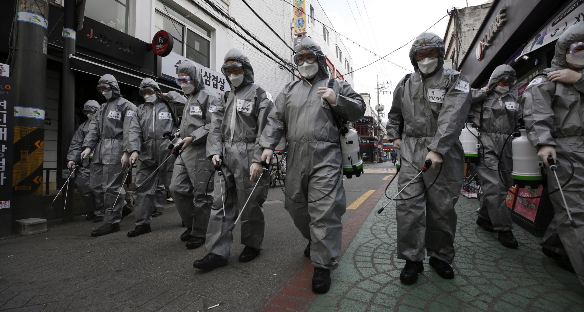 epa08268351 South Korean soldiers spray disinfectant in the street as a precaution against the spread of the novel coronavirus, in Seoul, South Korea, 04 March 2020. With over 5,000 cases of coronavirus reported, South Korea currently accounts for the largest number of infections outside mainland China.  EPA/JEON HEON-KYUN