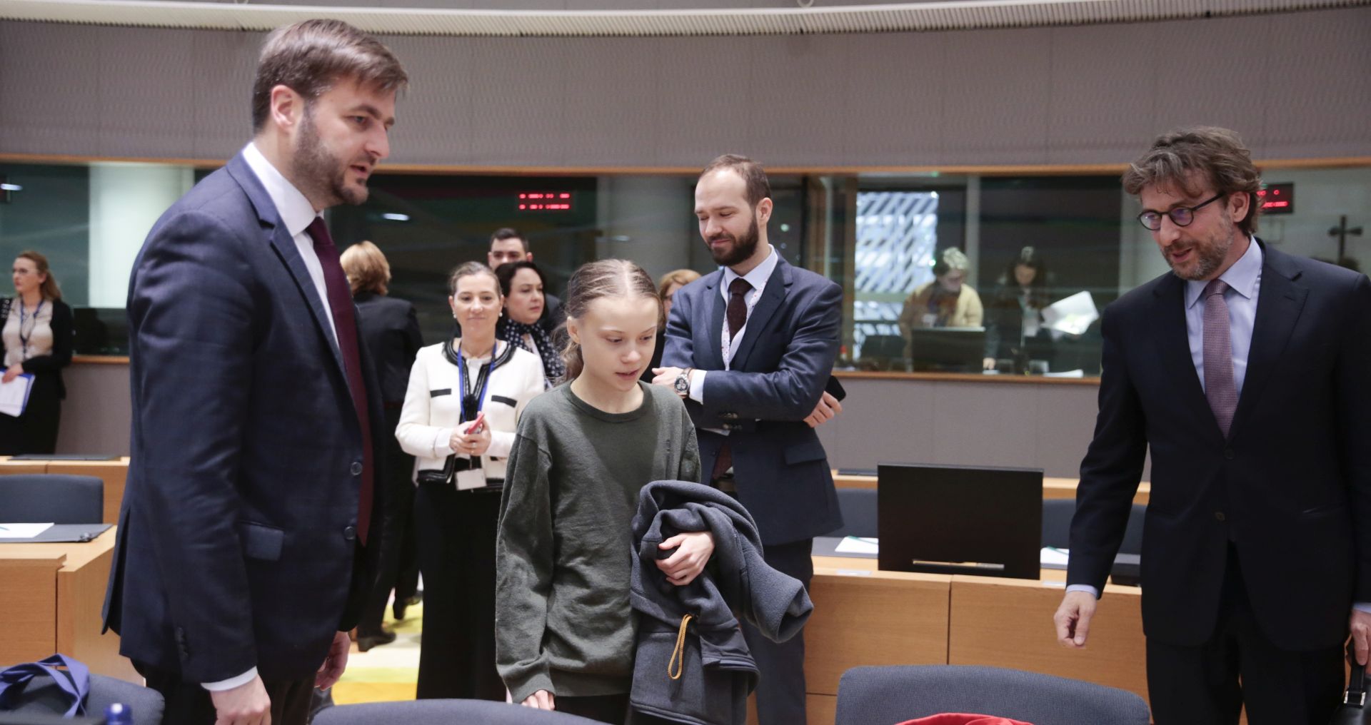 epa08271141 Swedish climate activist Greta Thunberg (C-L) and Minister of Environment and Energy of Croatia, Tomislav Coric (L) arrive at a meeting of EU environment ministers in Brussels, Belgium, 05 March 2020.  EPA/OLIVIER HOSLET