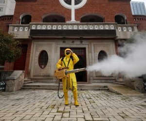 epa08273672 A volunteer disinfects a Christian church in Wuhan, Hubei province, China, 06 March 2020. Hubei province reported 126 new cases of COVID-19 on 05 March, all coming from the epicenter Wuhan.  EPA/LI KE CHINA OUT