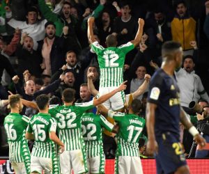 epa08279573 Betis' defender Sidnei (C, top) celebrates after scoring the 1-0 during the Spanish LaLiga soccer match between Real Betis and Real Madrid at Benito Villamarin in Seville, Andalusia, Spain, 08 March 2020.  EPA/RAUL CARO