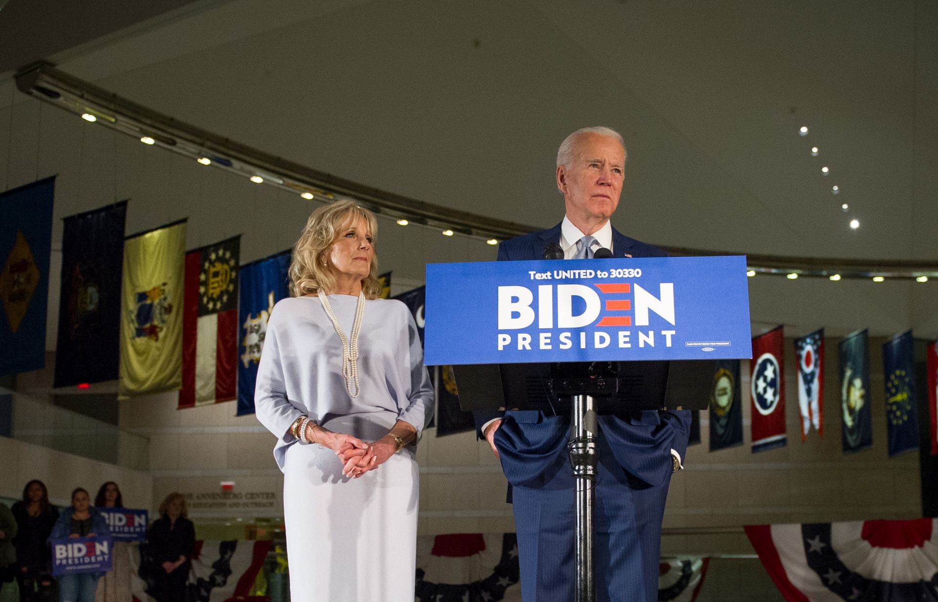 epaselect epa08284890 Democratic Party presidential candidate Joe Biden (R), accompanied by his wife Jill Biden (L), speaks at a primary night event at the National Constitution Center in Philadelphia, Pennsylvania, USA, 10 March 2020. Results from primary elections in five states come in on the evening of 10 March, as Biden and Sanders compete for the Democratic party nomination.  EPA/TRACIE VAN AUKEN