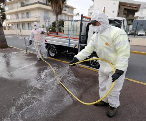 epa08320618 Municipal employees of the Villeneuve-Loubet city, work on cleaning and disinfecting store entrances and public places in Villeneuve-Loubet, southern France, 25 March 2020. France is under lockdown in an attempt to stop the widespread of the SARS-CoV-2 coronavirus causing the Covid-19 disease.  EPA/SEBASTIEN NOGIER