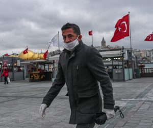 epa08321968 A man with a face mask and gloves walks in empty streets in Istanbul, Turkey, 25 March 2020. Turkish Health Minister Koca said on 24 March that there are 1,872 confirmed cases of the coronavirus and 44  related deaths from COVID-19. Turkey decided to halt public events, temporarily shut down schools and suspend sporting events in an attempt to prevent further spreading of the coronavirus.  EPA/SEDAT SUNA