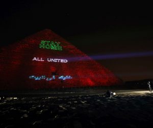 epa08332950 General view of the pyramids lit up with text encouraging Egyptians to stay home and safe because of COVID-19 and sending a thank you massage to those keeping poeple safe in Giza, Egypt, 30 March 2020. Egyptian authorities had announce a two-week curfew, which started on 25 March, during which public transportation will be suspended to avoid the spread of the SARS-CoV-2 coronavirus which causes the COVID-19 disease  EPA/KHALED ELFIQI