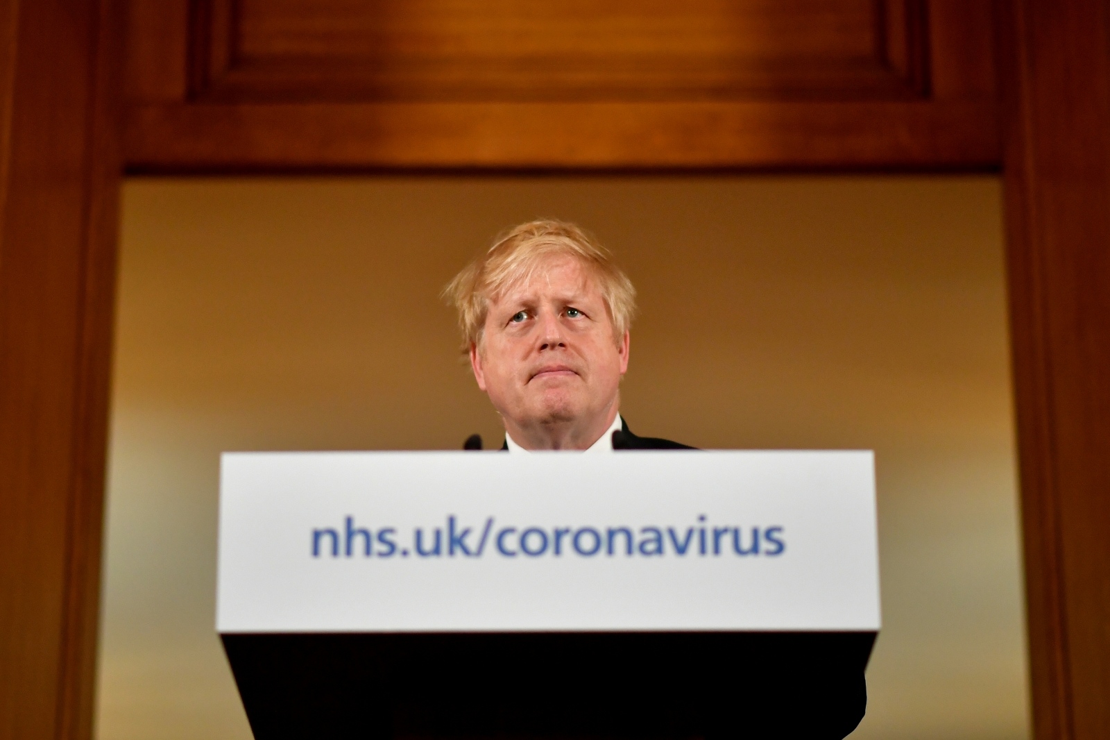 British PM Johnson gives daily address to nation on coronavirus in London British Prime Minister Boris Johnson looks on during a coronavirus disease (COVID-19) news conference inside 10 Downing Street, London, Britain March 19, 2020.  Leon Neal/Pool via REUTERS POOL
