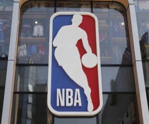 epa08288213 (FILE) - A view shows an NBA logo outside a store in Beijing, China, 09 October 2019. Utah Jazz center Rudy Gobert tested positive for COVID-19 it was announced 11 March 2020. The test result was announced just before tip-off of the Utah Jazz and Oklahoma City Thunder game at Chesapeake Bay Arena in Oklahoma City. The game was called off and shortly thereafter the National Basketball Association (NBA) announced the suspension of the 2020 season.  EPA/WU HONG *** Local Caption *** 55533593
