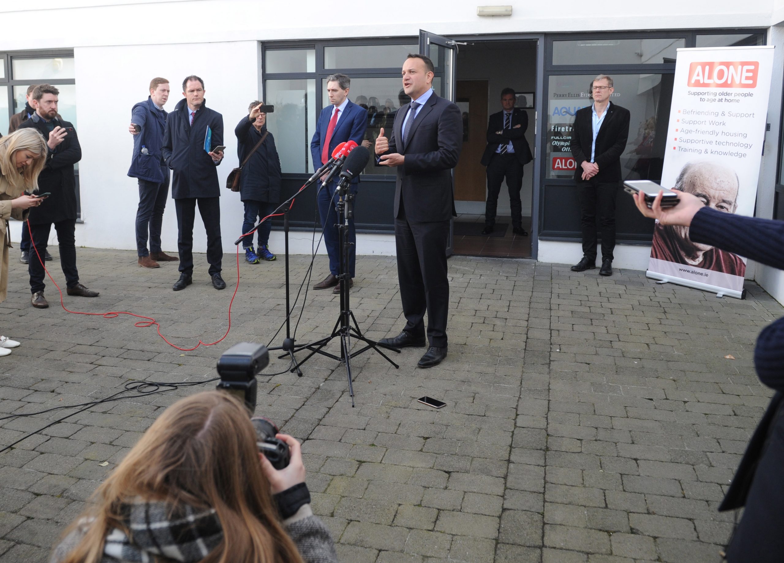 epa08315897 Journalists observe social distancing while Irish Prime Minister (An Taoiseach) Leo Varadkar (C) speaks to them in Dublin City in Dublin City, Ireland, 23 March 2020.   Ireland currenty has approximately 1,000 cases of Covid-19 and  is opening up to 50 test centres around the country.  EPA/AIDAN CRAWLEY