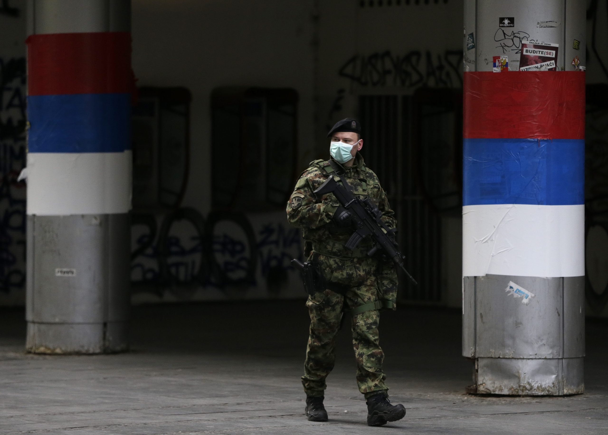 epa08316446 Serbian army soldiers patrol during the curfew starting 5PM till 5AM in Belgrade, Serbia, 23 March 2020. The Serbian authorities declared the state of emergency on Sunday 15 March over the situation with the coronavirus. Several European countries have closed borders, schools and public facilities, and have cancelled major sports and entertainment events in order to prevent the spread of the coronavirus SARS-CoV-2 which causes the Covid-19 disease.  EPA/MARKO DJOKOVIC
