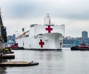 epa08334045 A handout photo made available by the Federal Emergency Management Agengcy shows the USNS Comfort arriving at New York Harbor in New York, New York, USA, 30 March 2020 (issued 31 March 2020). The ship, which has a 1,000 bed hospital on board, will help alleviate the burden being put on the region's hospital system as a result of the large number of coronavirus COVID-19 patients.  EPA/Kenneth Wilsey / Federal Emergency Management Agency HANDOUT  HANDOUT EDITORIAL USE ONLY/NO SALES