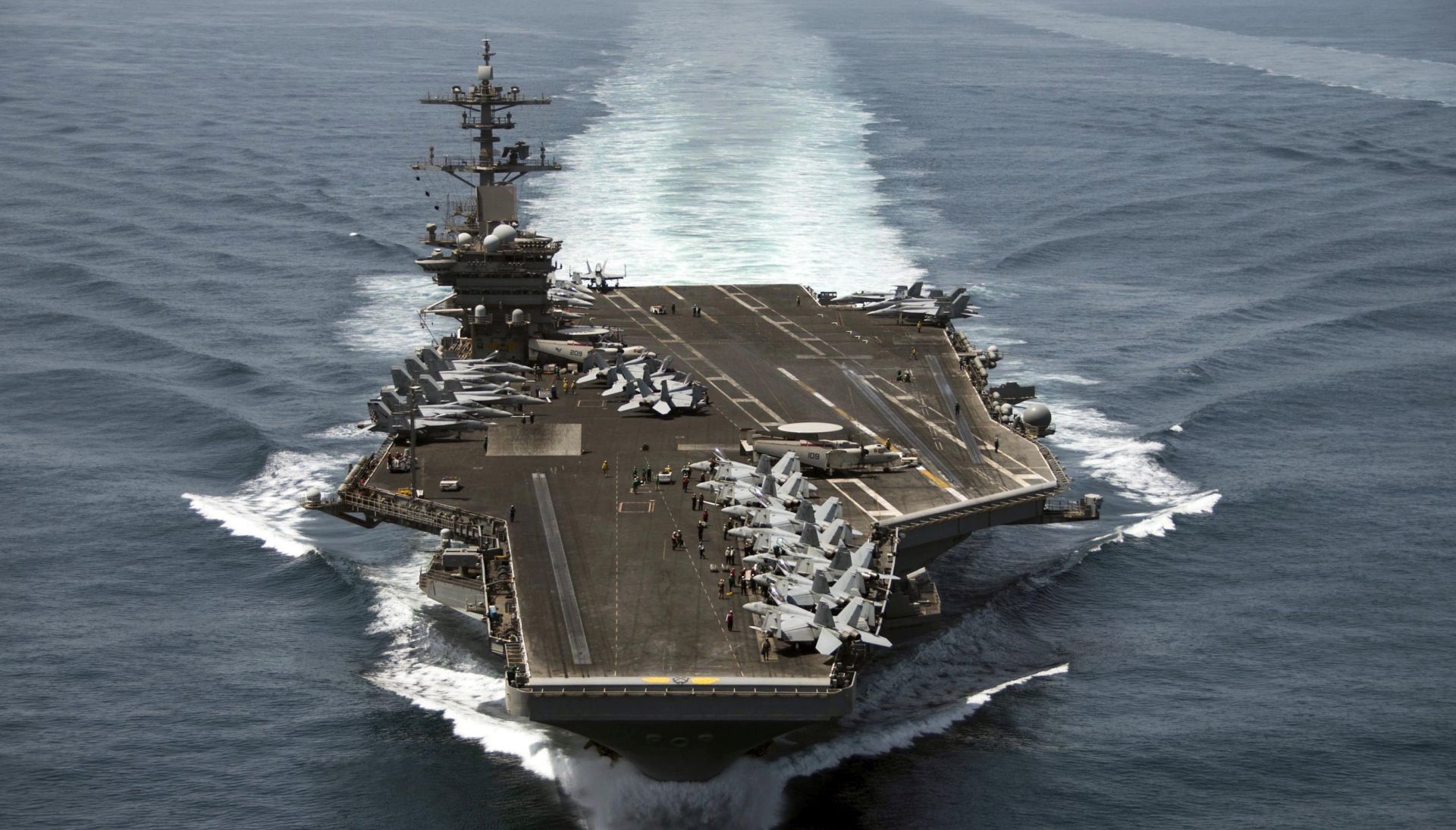 epa08335877 (FILE) - An aerial handout image made available by US Navy showing the aircraft carrier USS Theodore Roosevelt (CVN 71) operating in the Arabian Sea on 21 April 2015 (reissued 01 April 2020). According to reports,  Captain Brett Crozier, captain of the US aircraft carrier Theodore Roosevelt, which is currently docked in Gua, has penned a letter calling for decisive action to be taken to avert deaths on the carrier.  EPA/MC3 ANTHONY N. HILKOWSKI / HANDOUT  HANDOUT EDITORIAL USE ONLY/NO SALES