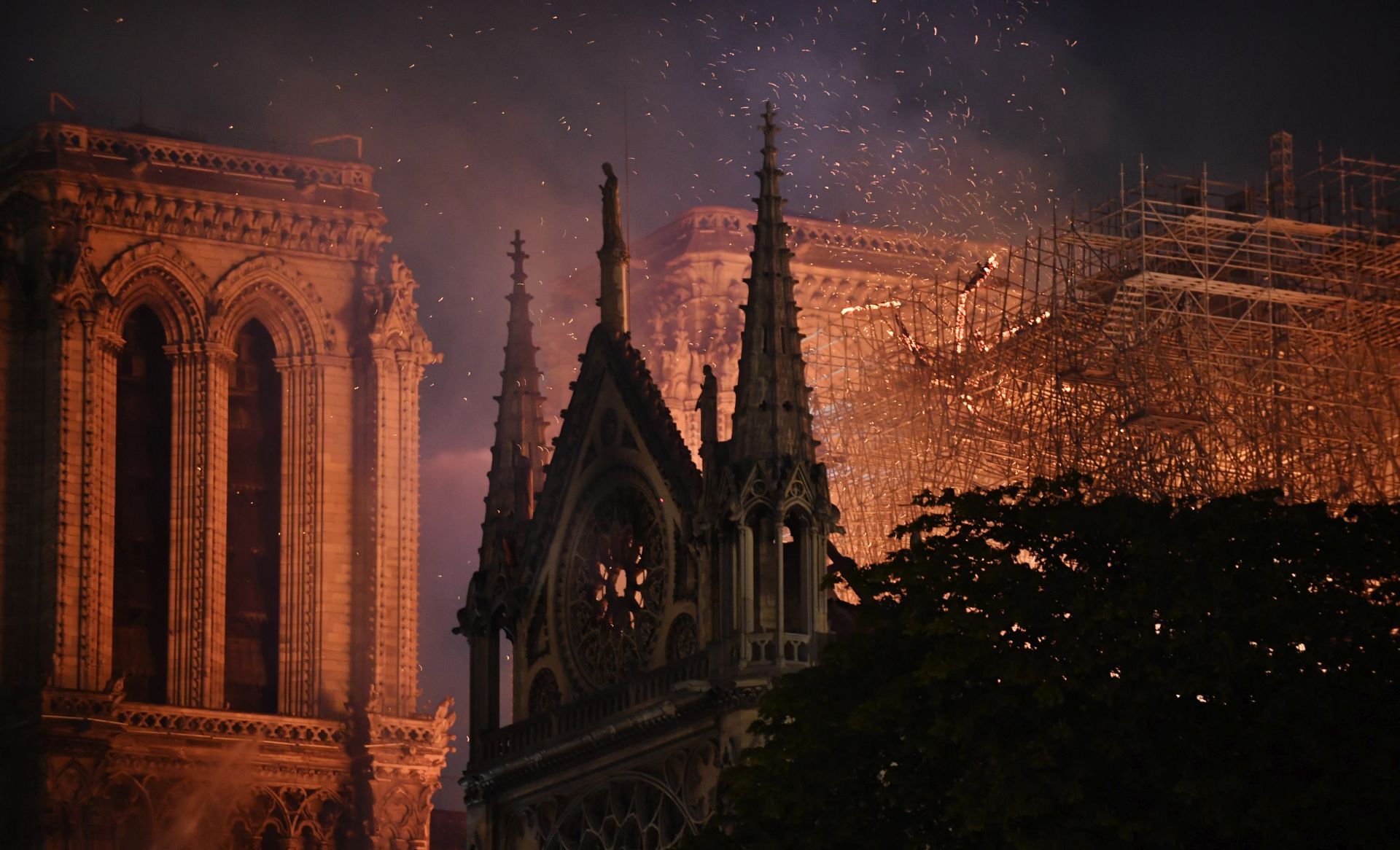 epa08345201 (FILE) The flames burning the roof of the Notre-Dame Cathedral in Paris, France, 15 April 2019 (reissued 06 April 2020). A year ago, on 15 April 2019, the 850-year-old Notre-Dame Cathedral of Paris suffered a devastating fire. Some 500 firefighters managed to prevent the entire cathedral from being reduced to ashes, although its celebrated spire has been destroyed. French President Emmanuel Macron promised to rebuild the cathedral within five years.  EPA/JULIEN DE ROSA ATTENTION: This Image is part of a PHOTO SET *** Local Caption *** 55128799