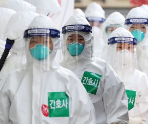 epa08347531 Nurses in full protective suits line up to enter the treatment ward for novel coronavirus patients at the Dongsan Hospital in Daegu, some 300 kilometers southeast of Seoul, South Korea, 07 April 2020.  EPA/YONHAP SOUTH KOREA OUT