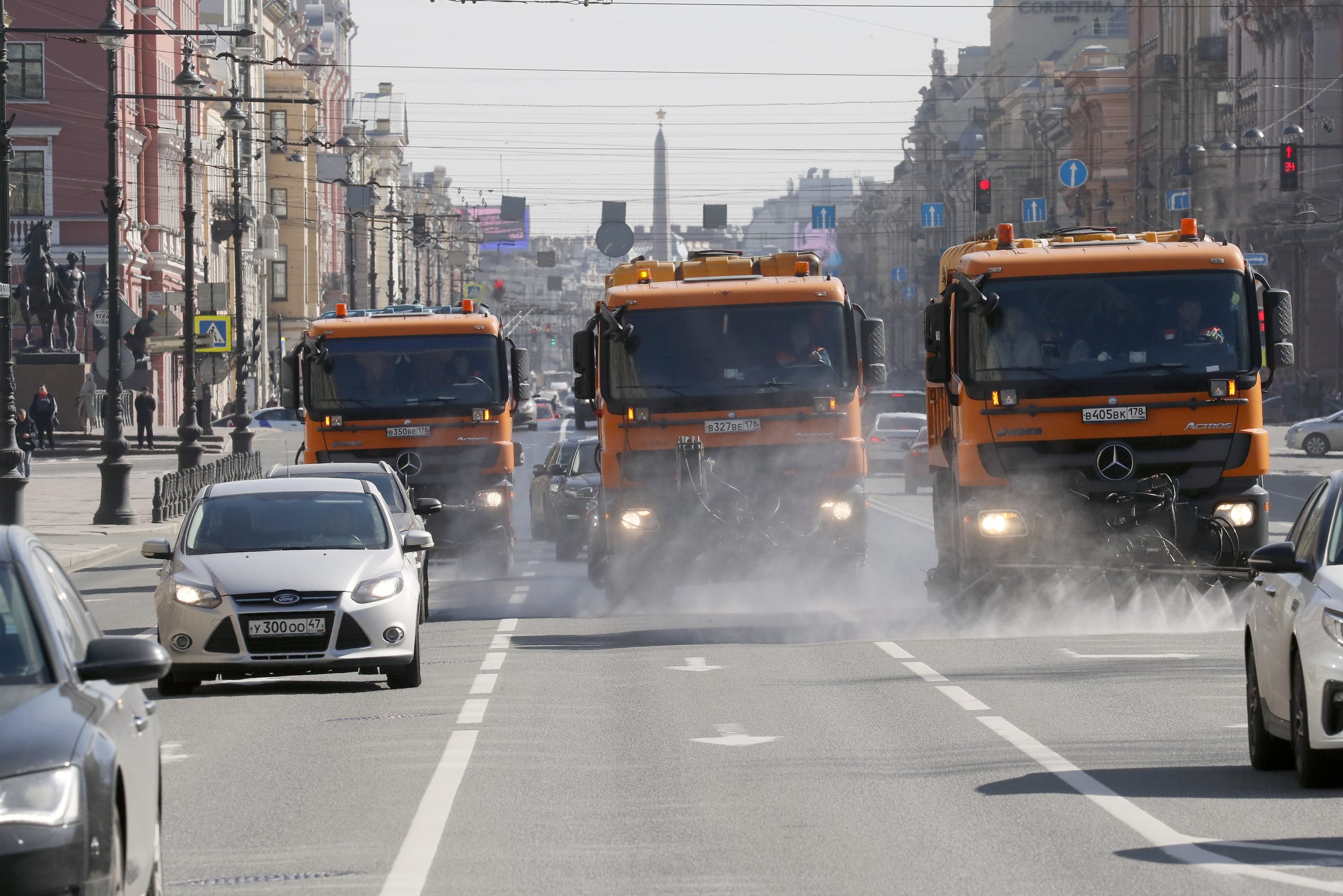 epa08348283 Cleaning cars disinfecting the Nevsky Prospekt in St. Petersburg, Russia, 07 April 2020. Russian authorities have extended the national lockdown with stay-at-home orders until the end of April in a bid to quell the spread of the COVID-19.  EPA/ANATOLY MALTSEV