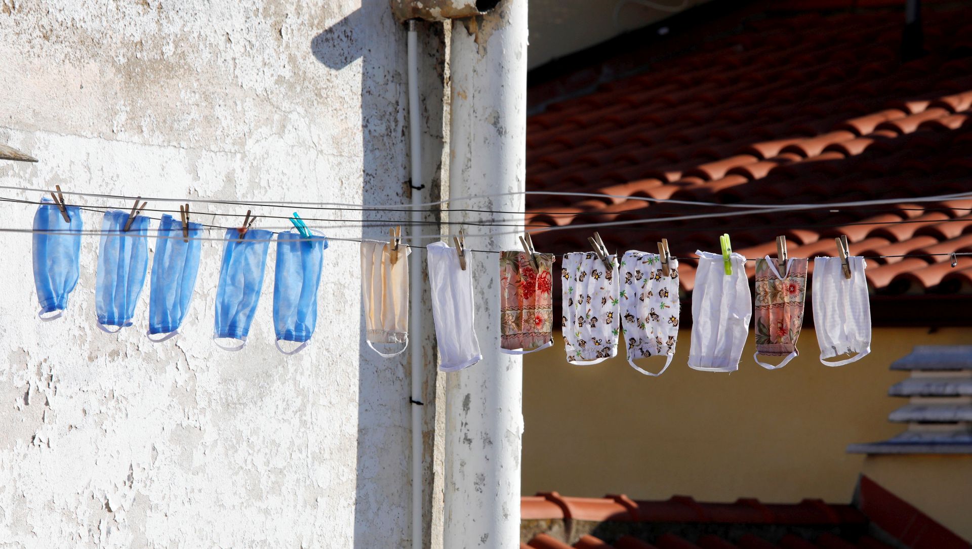 epa08350553 Facial masks are seen hanged out in Montbui, Barcelona, Spain, 08 April 2020. Spain faces the 25th consecutive day of mandatory home confinement in a bid to slow down the spread of the pandemic COVID-19 disease caused by the SARS-CoV-2 coronavirus.  EPA/Susanna Saez