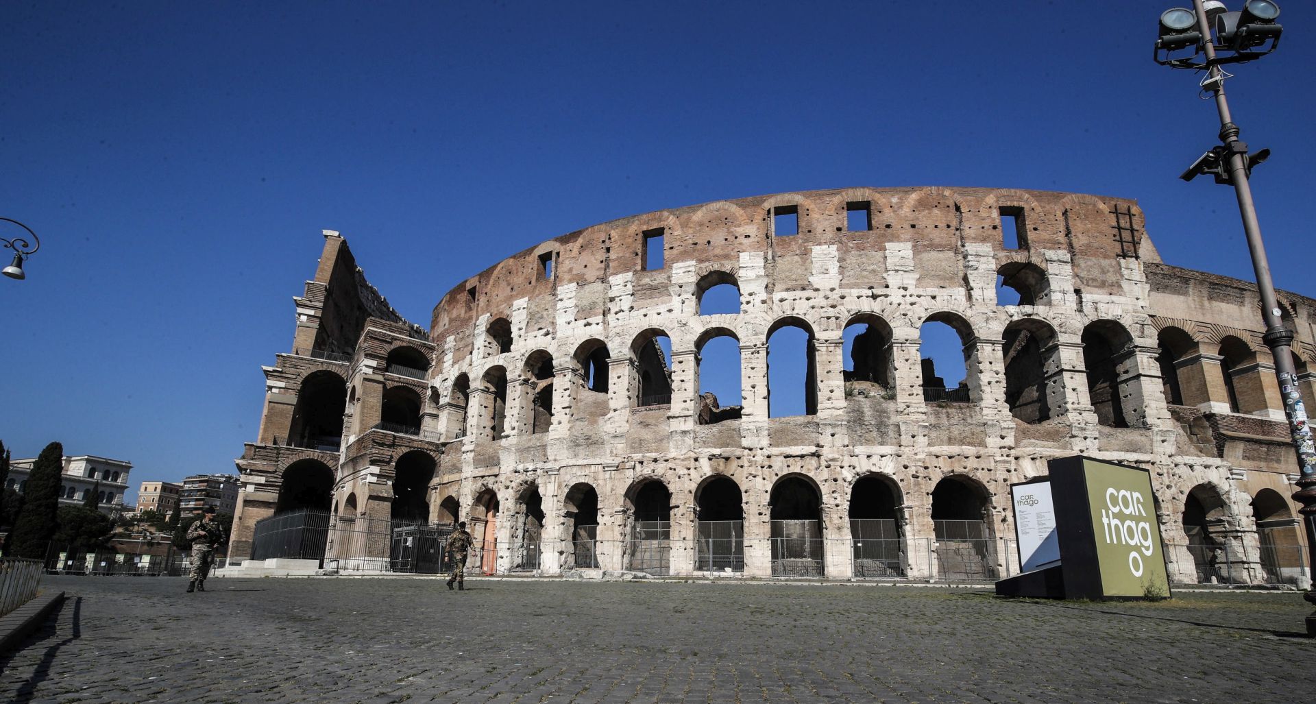 epa08357645 General view of deserted Colosseum in central Rome, Italy, 11 April 2020. The Italian Ministry of the Interior on 09 April sent a directive to prefects demanding to beef up coronavirus lockdown controls over the Easter holiday.  EPA/GIUSEPPE LAMI
