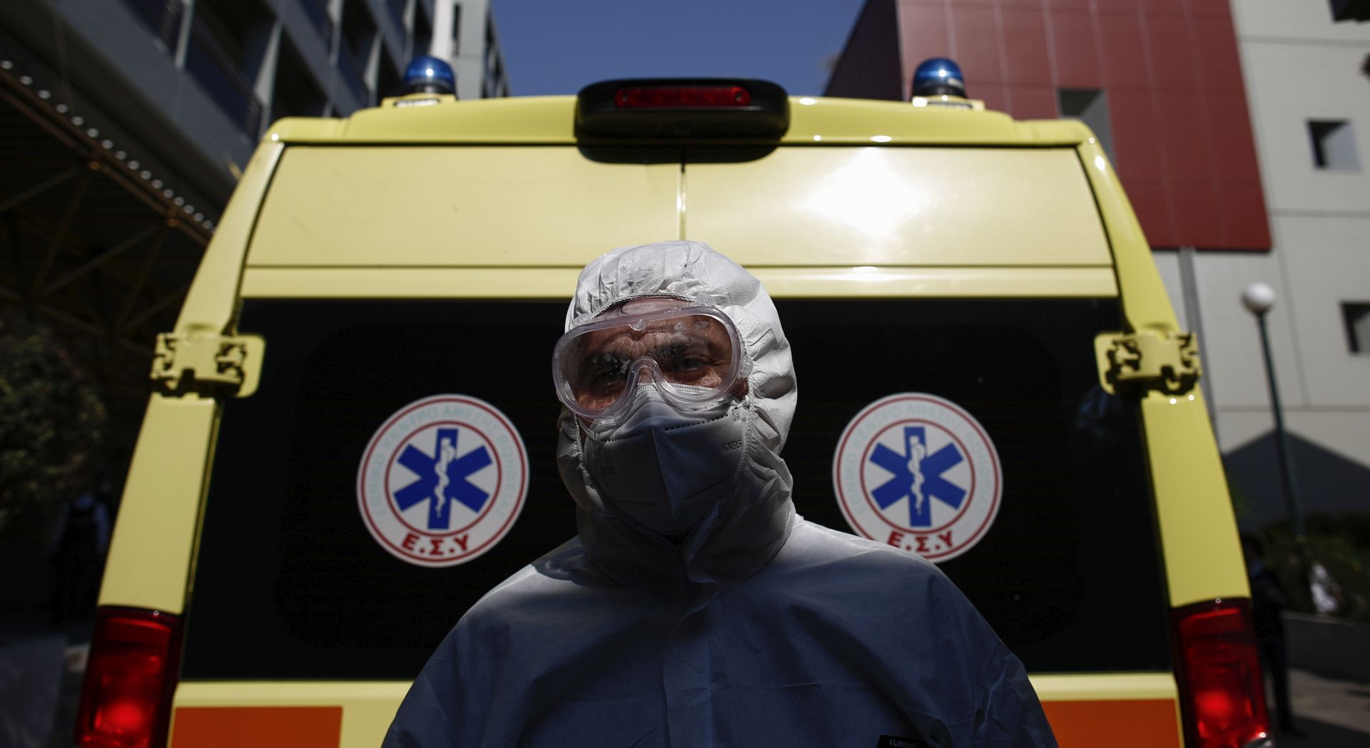 epa08361526 National Emergency Center worker Elias Nikas wears protective gear while poseing for a photograph after transporting a patient with a COVID-19, at a hospital in Athens, Greece, 11 April 2020 (issued 14 April 2020). 'The coronavirus pandemic is subsiding, but the war is not won yet,' Prime Minister Kyriakos Mitsotakis said in a televised message on the evening of 13 April, thanking the Greek people for their trust and discipline and calling on them to continue to respect restrictive measures.  EPA/YANNIS KOLESIDIS