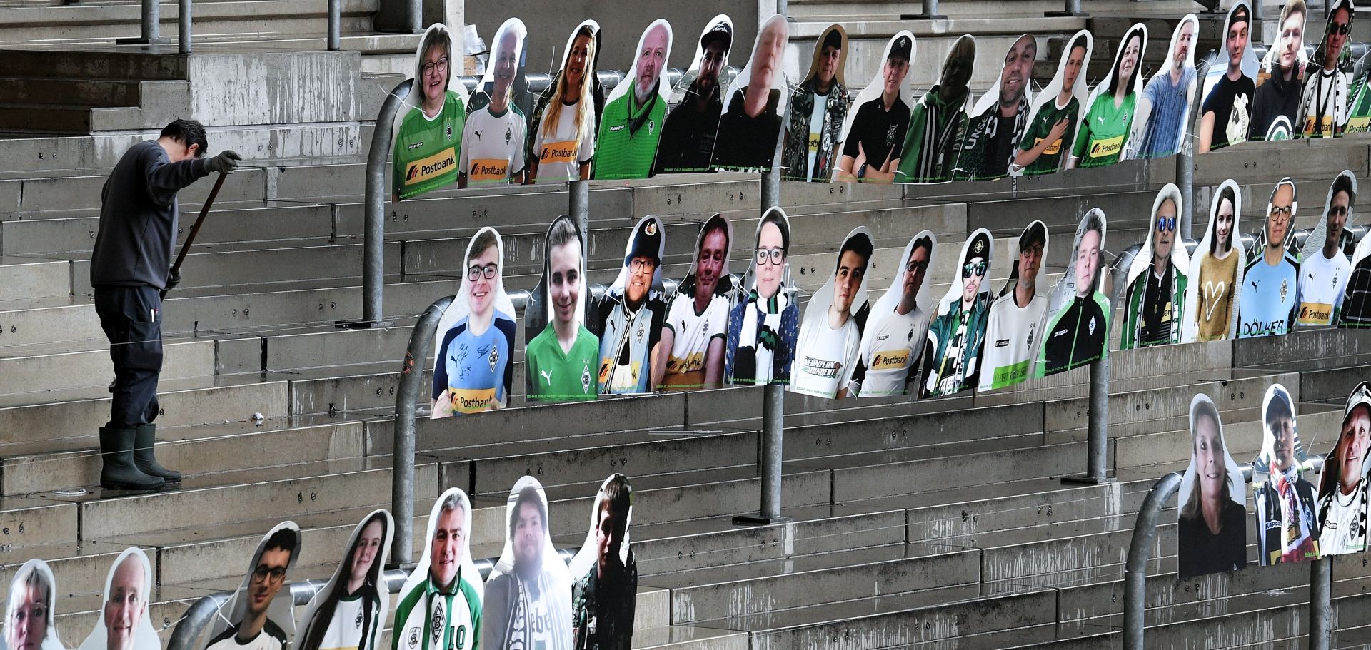 epa08365755 Cardboard cutouts showing supporters of German Bundesliga's football club Borussia Moenchengladbach are installed on the stands at Borussia Park stadium in Moenchengladbach, Germany, 16 April 2020. Supporters of Borussia Moenchengladbach wanted to contribute to a better atmosphere during 'ghost games' in the German Bundesliga. The German government and local authorities have heightened measures to stem the spread of COVID-19. The federal and state conference on the coronavirus crisis had confirmed that all upcoming major events would be suspended until 31 August 2020.  EPA/SASCHA STEINBACH