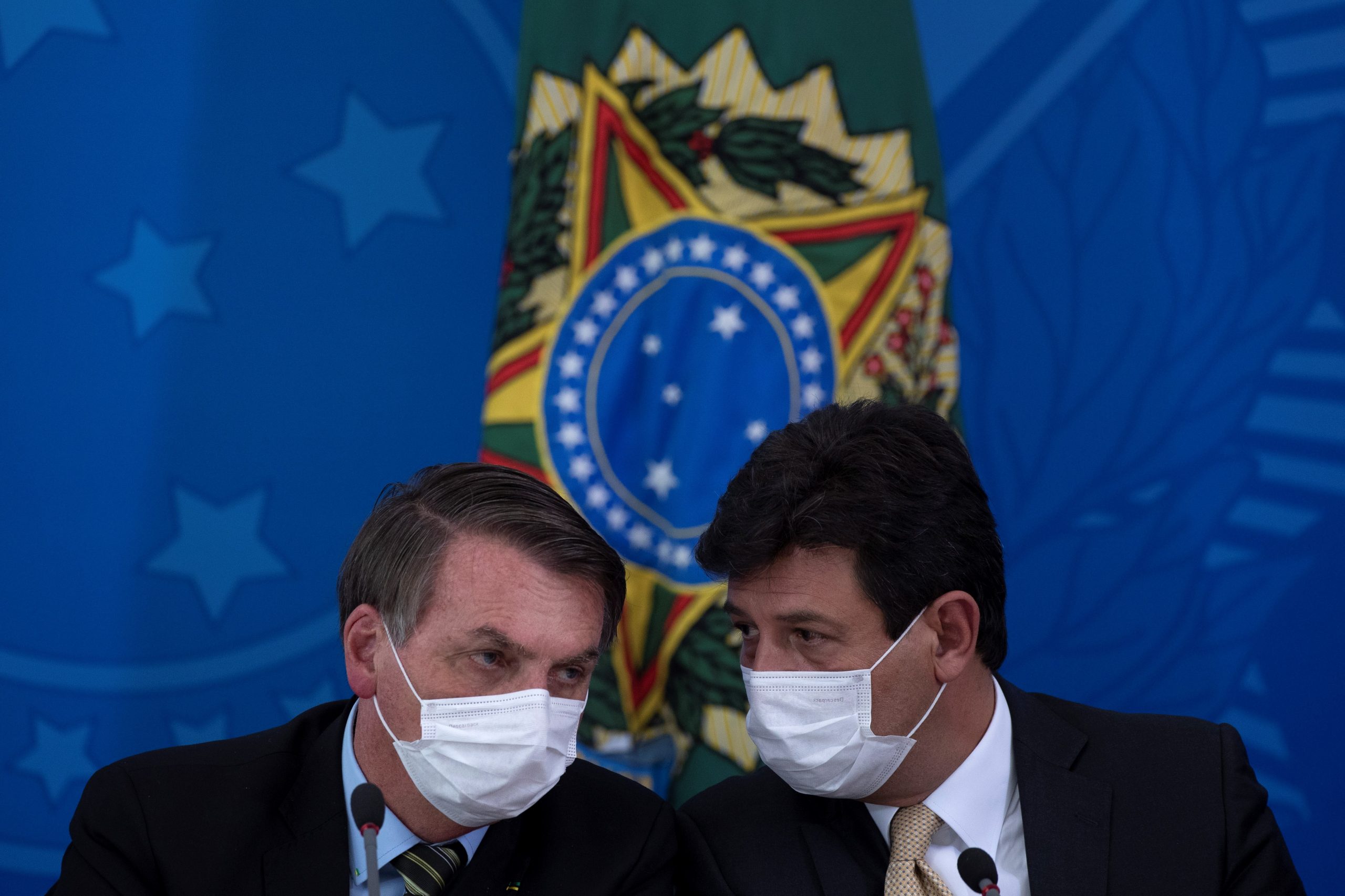 epa08367449 (FILE) President of Brazil Jair Bolsonaro (L) and the Minister of Health Luiz Henrique Mandetta (R) attend a press conference on the measures taken by the government against the spread of the coronavirus, in Brasilia, Brazil, 18 March 2020 (reissued 16 April 2020). According to reports, Brazilian President Jair Bolsonaro on 16 April has fired Brazilian Health Minister Luiz Henrique Mandetta over differences on the respond to the SARS-CoV-2 coronavirus pandemic which causes the Covid-19 disease.  EPA/JOEDSON ALVES