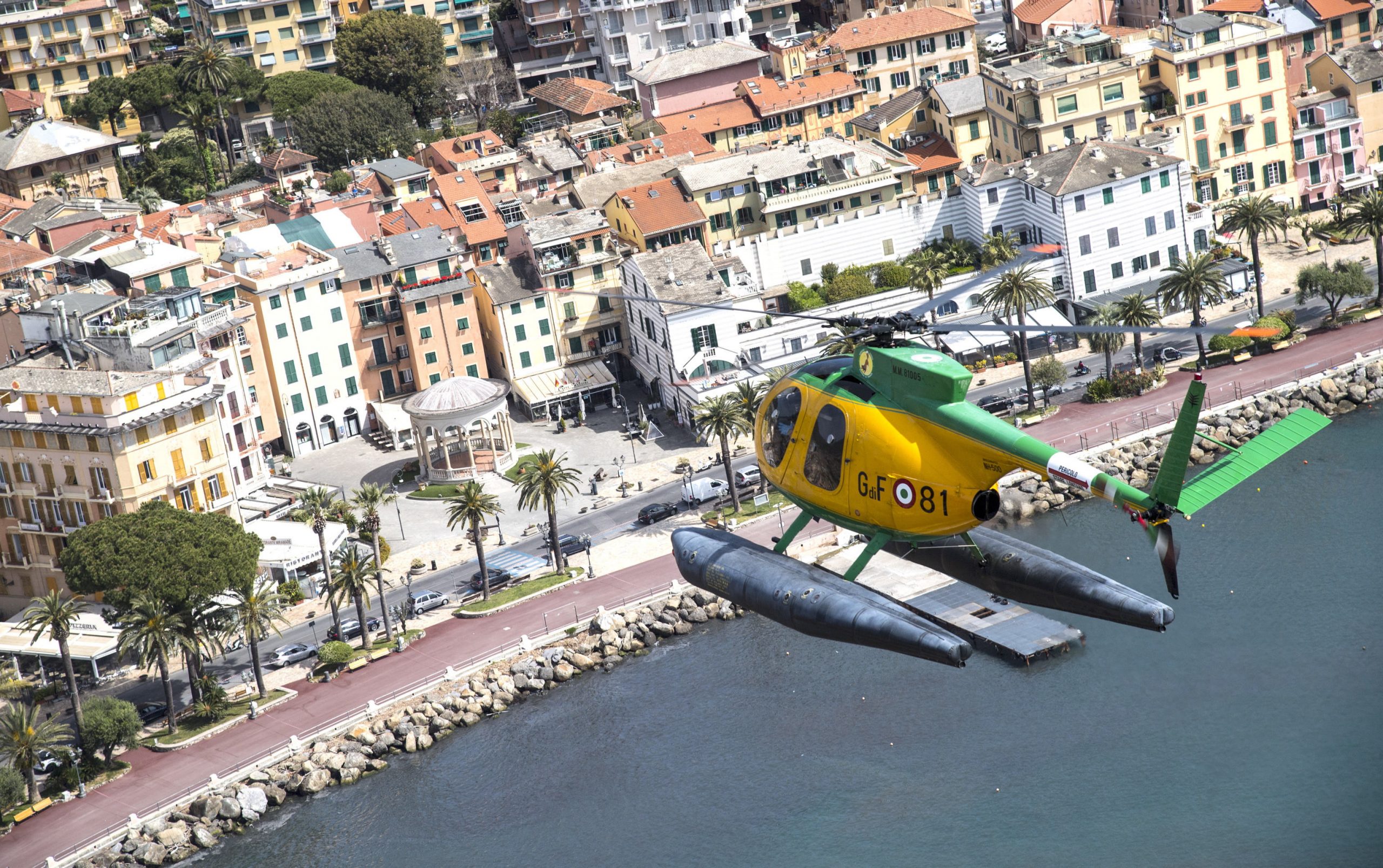 epa08370253 An aerial view shows a Guardia di Finanza (GdF, Economic and Financial Police) helicopter during a patrolling flight of the Ligurian Riviera, in Genoa, northern Italy, 18 April 2020, during a nationwide lockdown over the coronavirus disease (COVID-19) pandemic. Countries around the world are taking increased measures to stem the widespread of the SARS-CoV-2 coronavirus which causes the COVID-19 disease.  EPA/LUCA ZENNARO