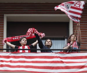 epa08370606 Athletic Bilbao supporters are seen at their balcony in Bilbao, Basque Country, Spain on 18 April 2020, when the King's Cup Final match between Athletic Bilbao and Real Sociedad should have taken place in Sevilla, but due to coronavirus has been postponed to an unknown day.  EPA/Luis Tejido