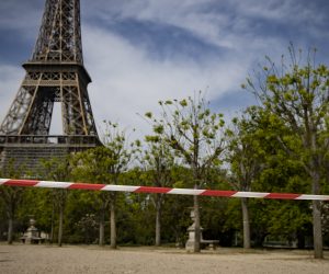 epa08375425 Police tape cordons off Champs de Mars parc near Eiffel Tower in Paris, France, 21 April 2020. France is under lockdown in an attempt to stop the widespread of the SARS-CoV-2 coronavirus causing the Covid-19 disease.  EPA/IAN LANGSDON