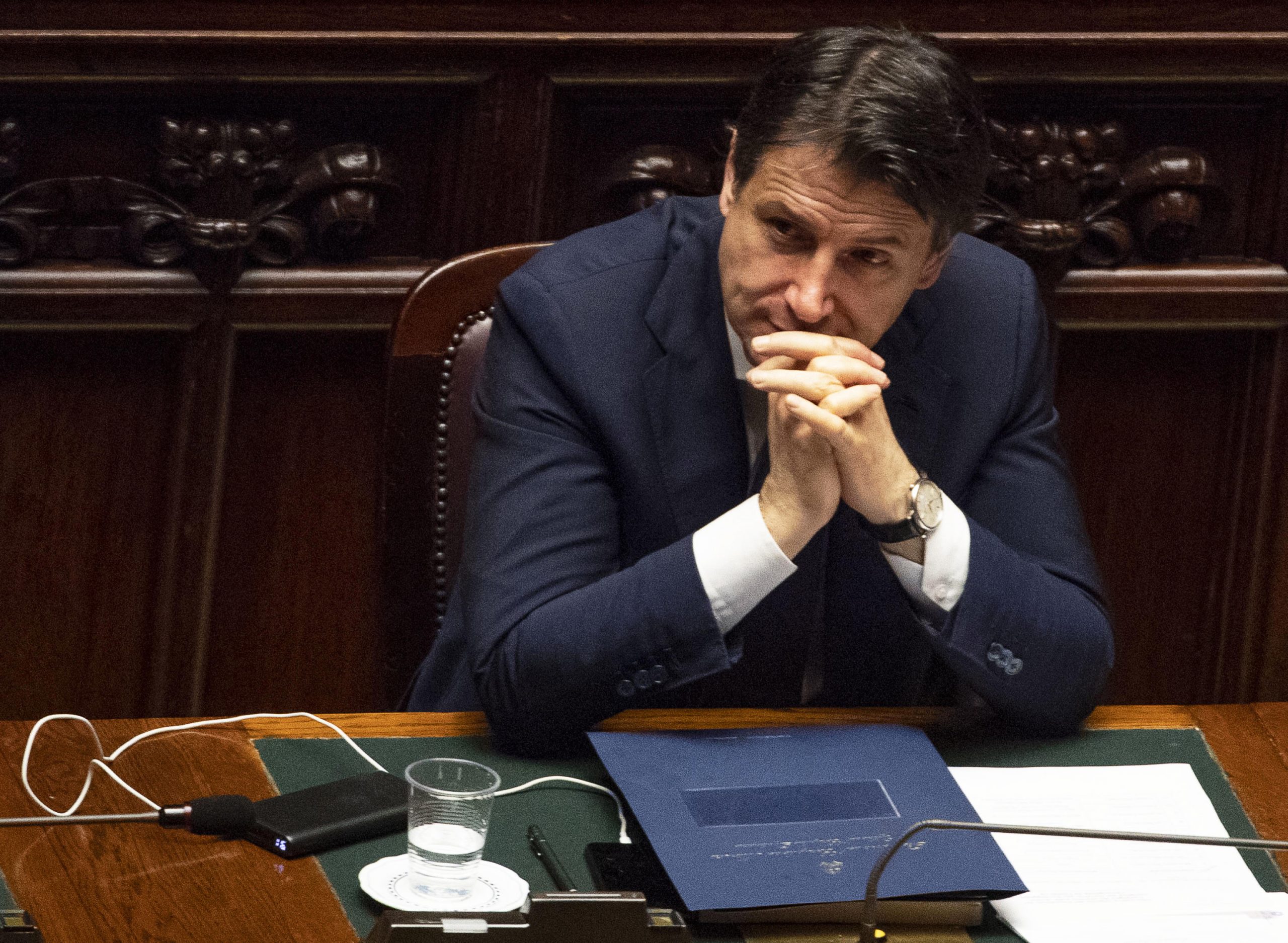 epa08375959 Italian Prime Minister Giuseppe Conte reacts after he communicated the recent government initiatives to the deputies to cope with the COVID-19 pandemic in the Montecitorio hall in Rome, Italy, 21 April 2020.  EPA/MAURIZIO BRAMBATTI