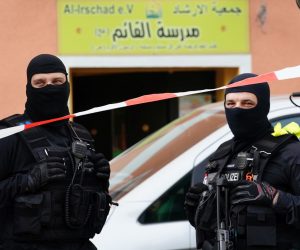 epa08392686 Armed police officers stand guard in front of the Al-Irschad association in Berlin, Germany, 30 April 2020. The German Minister of Interior, Construction and Homeland announced on the day that it has banned Iran-backed Hezbollah activity on German soil and designated it a terrorist organization. Police conducted early morning raids on mosque associations in several federal states, media reported.  EPA/CLEMENS BILAN