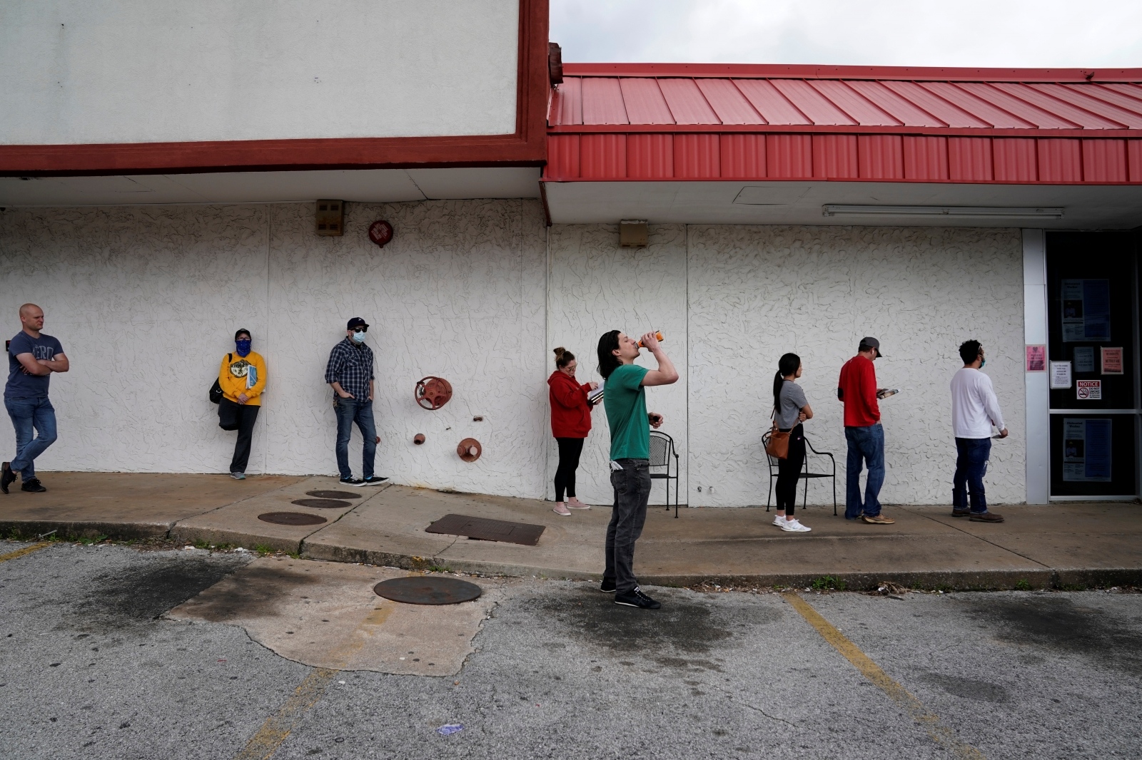The spread of the coronavirus disease (COVID-19), in Fayetteville People who lost their jobs wait in line to file for unemployment following an outbreak of the coronavirus disease (COVID-19), at an Arkansas Workforce Center in Fayetteville, Arkansas, U.S. April 6, 2020. REUTERS/Nick Oxford NICK OXFORD